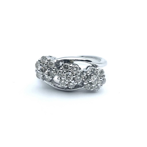 757 - An 18ct white gold and diamond crossover ring, set with three clusters of round brilliant-cut diamon... 