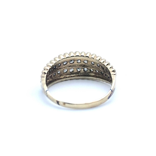 762 - A 9ct yellow gold and diamond ring, the tapered band with beaded effect decoraton, inset with two ro... 