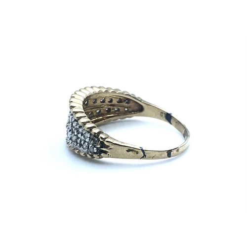 762 - A 9ct yellow gold and diamond ring, the tapered band with beaded effect decoraton, inset with two ro... 