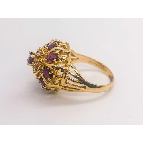 776 - A 14ct yellow gold, diamond, and ruby 'princess' dome ring, set with pear-cut rubies and small diamo... 