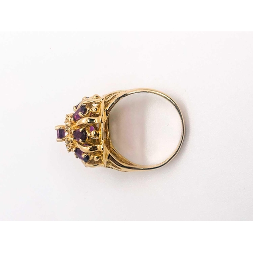 776 - A 14ct yellow gold, diamond, and ruby 'princess' dome ring, set with pear-cut rubies and small diamo... 