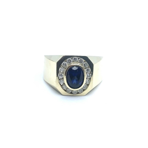 788 - A 14ct yellow gold and cz gents ring, set with an oval synthetic sapphire and small white CZs in a c... 