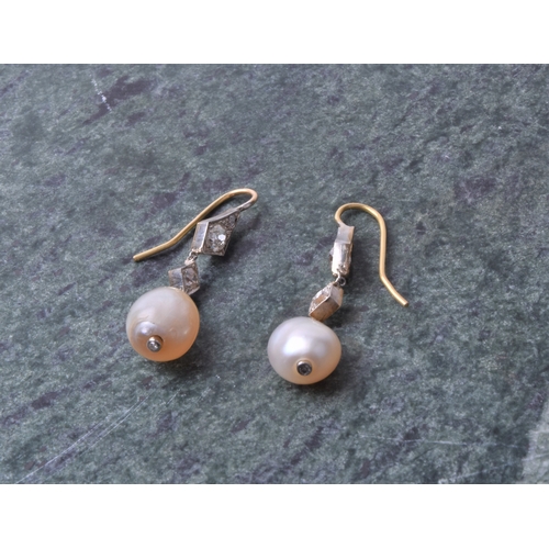 720 - A pair of diamond and natural pearl drop earrings, each with two diamond-shaped mounts inset with ol... 