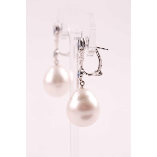 107 - A pair of South Sea pearl, diamond and sapphire drop earrings, the pearl approximately 16.5 mm high,... 