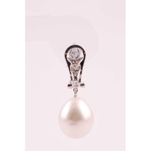 107 - A pair of South Sea pearl, diamond and sapphire drop earrings, the pearl approximately 16.5 mm high,... 