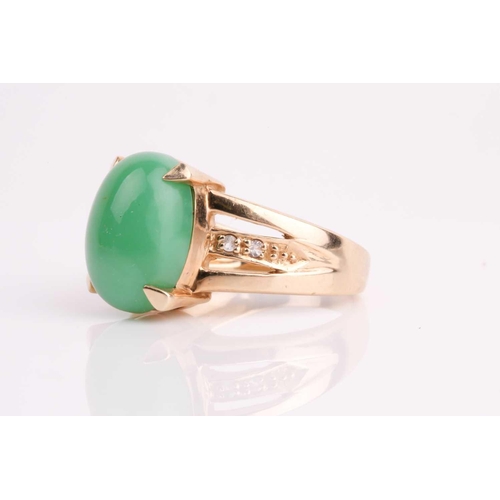 108 - A jade and diamond ring, the oval jade cabochon, 14 x 10 mm, four claw mounts, to open-work diamond ... 