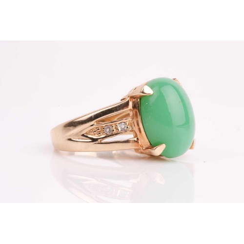 108 - A jade and diamond ring, the oval jade cabochon, 14 x 10 mm, four claw mounts, to open-work diamond ... 