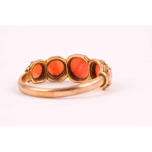 110 - A Georgian yellow gold and coral ring, set with five cabochon coral, shank unmarked, size O, 2.8 gra... 