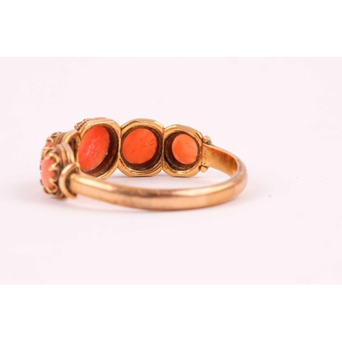 110 - A Georgian yellow gold and coral ring, set with five cabochon coral, shank unmarked, size O, 2.8 gra... 