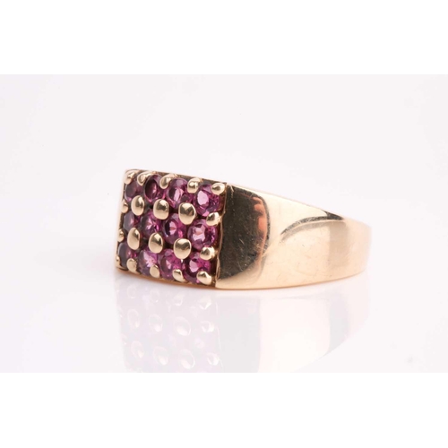 111 - A rectangular pink tourmaline cluster ring, in tapering 9ct gold shank. Size X, 7.7 grams