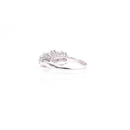 135 - A triple cluster diamond ring, the three slightly graduated brilliant cut diamonds in claw mounts wi... 