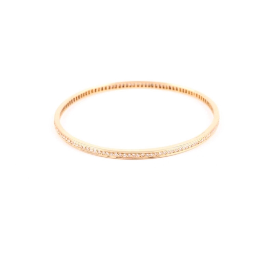 137 - An 18ct gold brilliant-cut diamond set bangle, approximately 70 mm diameter, 19.9 gramsCondition rep... 