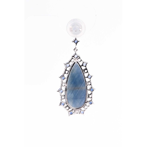 138 - A pair of sapphire pendant earrings, the tear-drop shaped faceted blue grey sapphire matrix centre w... 