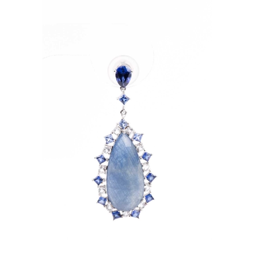 138 - A pair of sapphire pendant earrings, the tear-drop shaped faceted blue grey sapphire matrix centre w... 