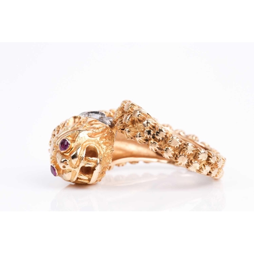 145 - An unusual Greek 18ct yellow gold lion-headed ring, in the style of Ilias Lalaounis, set with small ... 