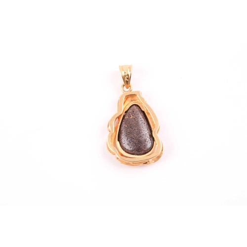 146 - An 18ct yellow gold and boulder opal pendant, of stylised naturalistic design, the mount with matte ... 