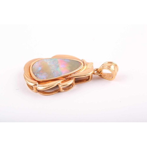 146 - An 18ct yellow gold and boulder opal pendant, of stylised naturalistic design, the mount with matte ... 