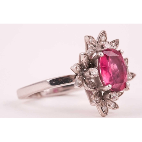 157 - A diamond and pink tourmaline cocktail ring, set with a mixed oval-cut tourmaline of approximately 4... 