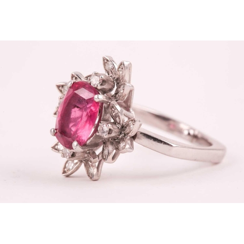 157 - A diamond and pink tourmaline cocktail ring, set with a mixed oval-cut tourmaline of approximately 4... 