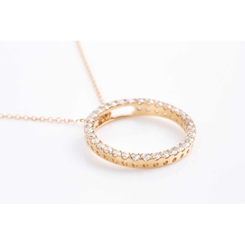 169 - An 18ct yellow gold and diamond halo pendant, set with round brilliant-cut diamonds, pendant approxi... 