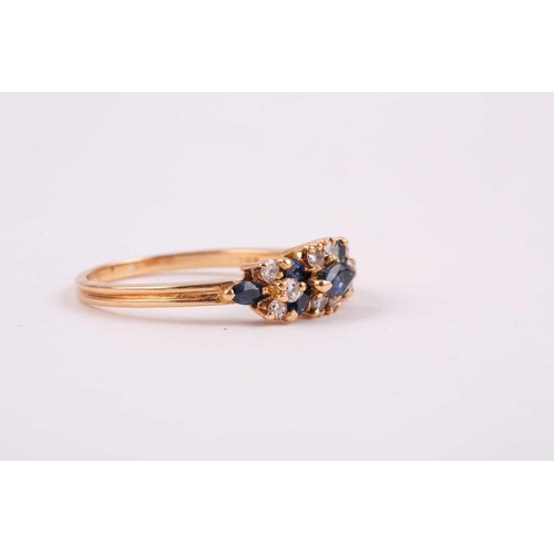 174 - An 18ct yellow gold, diamond, and sapphire ring, set with seven mixed marquise-cut sapphires, and te... 