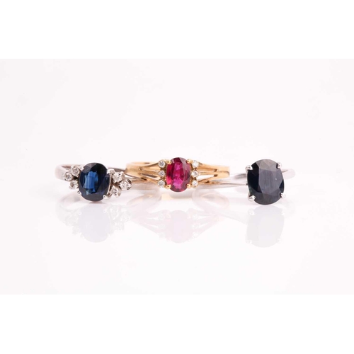 176 - A white metal and single stone sapphire ring, set with a mixed oval-cut sapphire, the shank marked 1... 