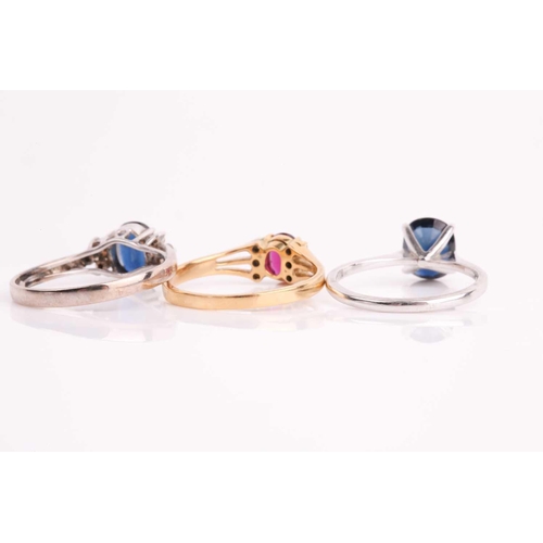 176 - A white metal and single stone sapphire ring, set with a mixed oval-cut sapphire, the shank marked 1... 