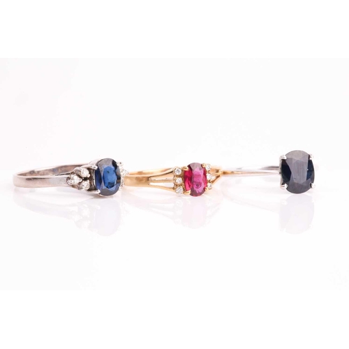 176 - A white metal and single stone sapphire ring, set with a mixed oval-cut sapphire, the shank marked 1... 