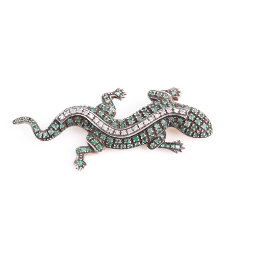 179 - An emerald and diamond salamander brooch, the wriggling amphibian with claw set bands of circular-cu... 