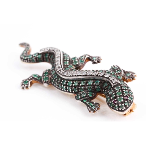 179 - An emerald and diamond salamander brooch, the wriggling amphibian with claw set bands of circular-cu... 