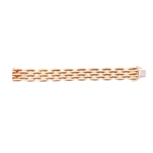 180 - Cartier. A late 20th century 18ct yellow gold Gentiane bracelet, comprised of five rows of elongated... 