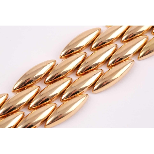 180 - Cartier. A late 20th century 18ct yellow gold Gentiane bracelet, comprised of five rows of elongated... 