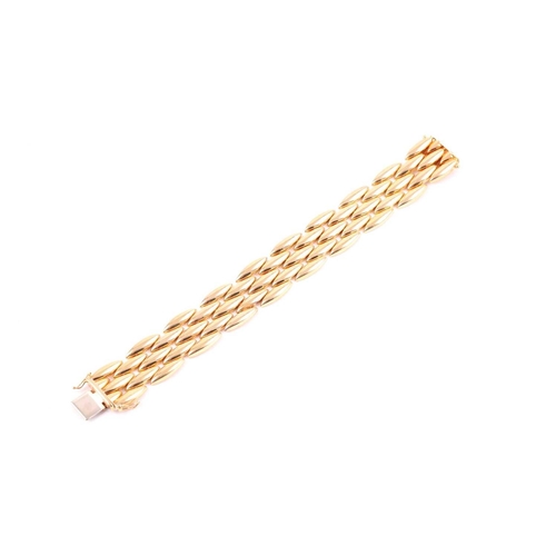 180 - Cartier. A late 20th century 18ct yellow gold Gentiane bracelet, comprised of five rows of elongated... 