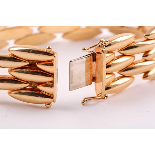 180 - Cartier. A late 20th century 18ct yellow gold Gentiane bracelet, comprised of five rows of elongated... 