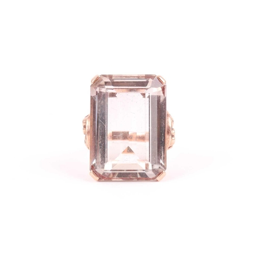 181 - A 9ct yellow gold and smoky quartz cocktail ring, set with a large rectangular-cut quartz 2.4 x 1.8 ... 