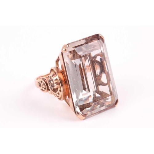 181 - A 9ct yellow gold and smoky quartz cocktail ring, set with a large rectangular-cut quartz 2.4 x 1.8 ... 