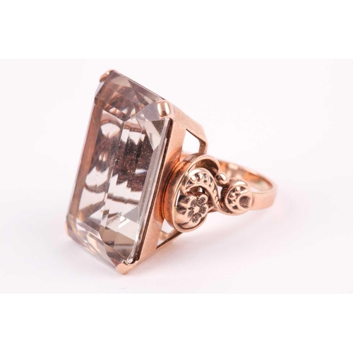 181 - A 9ct yellow gold and smoky quartz cocktail ring, set with a large rectangular-cut quartz 2.4 x 1.8 ... 