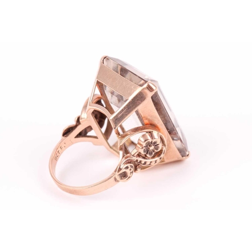 181 - A 9ct yellow gold and smoky quartz cocktail ring, set with a large rectangular-cut quartz 2.4 x 1.8 ... 