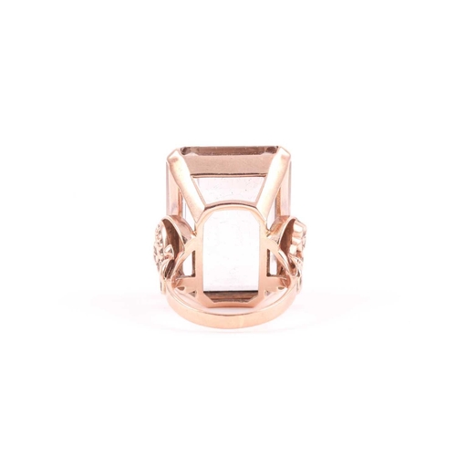 181 - A 9ct yellow gold and smoky quartz cocktail ring, set with a large rectangular-cut quartz 2.4 x 1.8 ... 