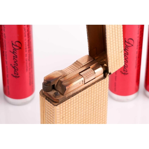 296 - A vintage S L Dupont French gold plated lighter and four Dupongaz refill cartridges
