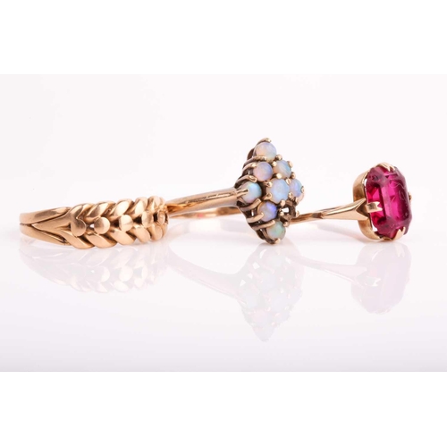 34 - A 9ct yellow gold and opal cluster ring (lacking one stone), size P, together with a 9ct and red pas... 