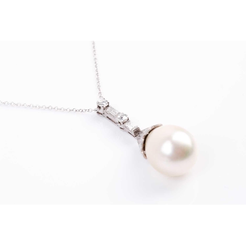 4 - A South Sea pearl and diamond pendant, the pear-shaped pearl beneath a brilliant-cut diamond set cap... 