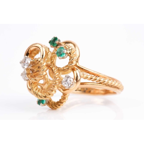 46 - An 18ct yellow gold, diamond and emerald abstract ring, the raised rope-twist mount inset with three... 