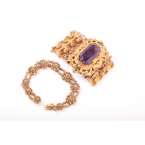 48A - A late 19th / early 20th century gilt metal bracelet, set with a large faceted amethyst-coloured gla... 