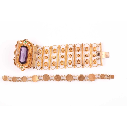 48A - A late 19th / early 20th century gilt metal bracelet, set with a large faceted amethyst-coloured gla... 