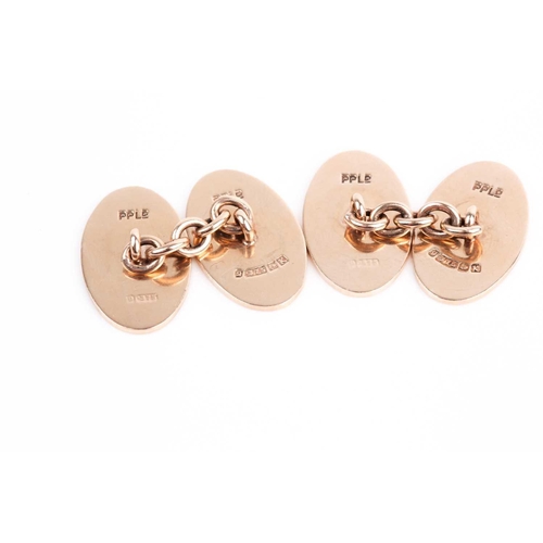 49 - A pair of 9ct yellow gold cufflinks, with oval plaques, one with floral engraved decoration, the oth... 