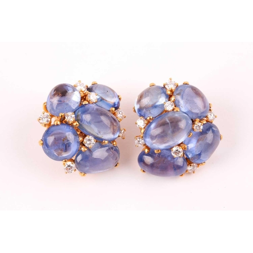 55 - A pair of cabochon sapphire and diamond cluster earrings; the ten mixed size polished stones claw-mo... 