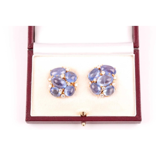 55 - A pair of cabochon sapphire and diamond cluster earrings; the ten mixed size polished stones claw-mo... 