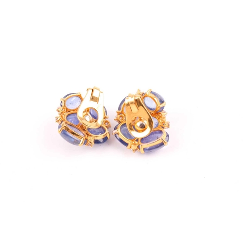 55 - A pair of cabochon sapphire and diamond cluster earrings; the ten mixed size polished stones claw-mo... 