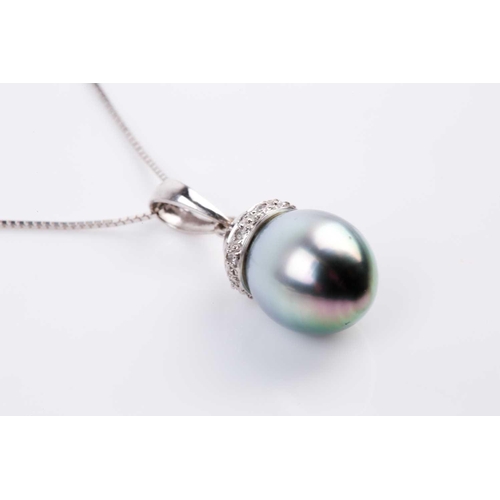 63 - A single stone Tahitian pearl and diamond pendant, the ovoid pearl with circular-cut diamond set aco... 